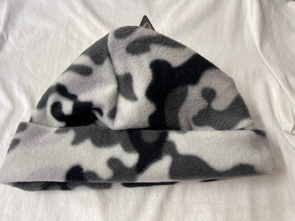 Camouflage-patterned beanie on a white background