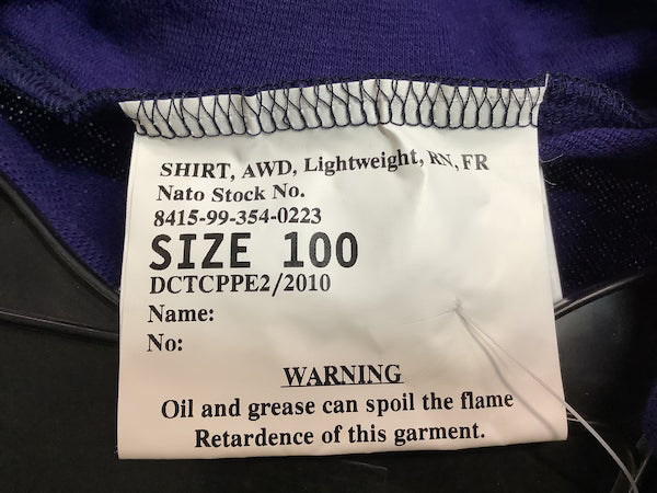 Clothing label with text on a dark fabric background
