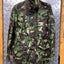 Camouflage jacket on a metal surface