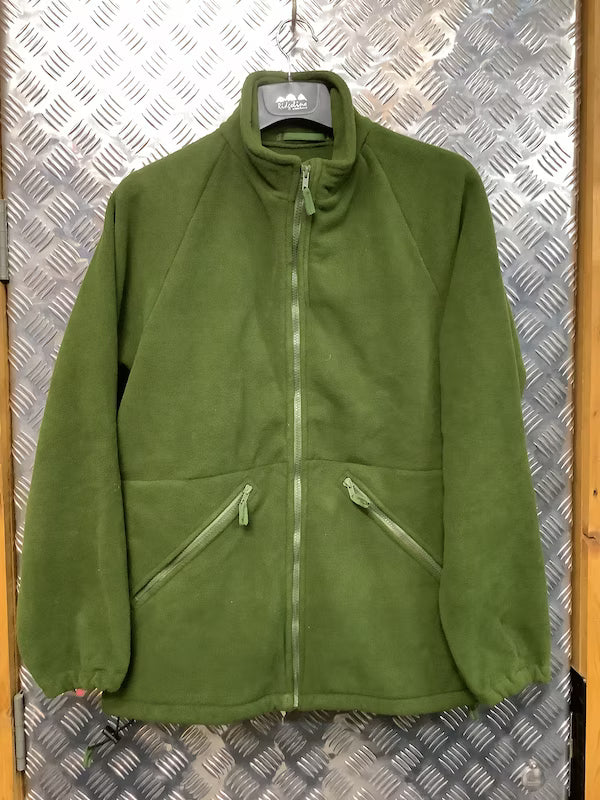 Green fleece jacket on a hanger against a metallic background