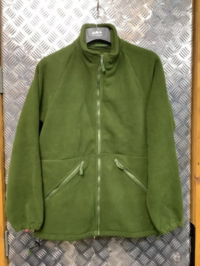 Green fleece jacket on a hanger against a metallic background