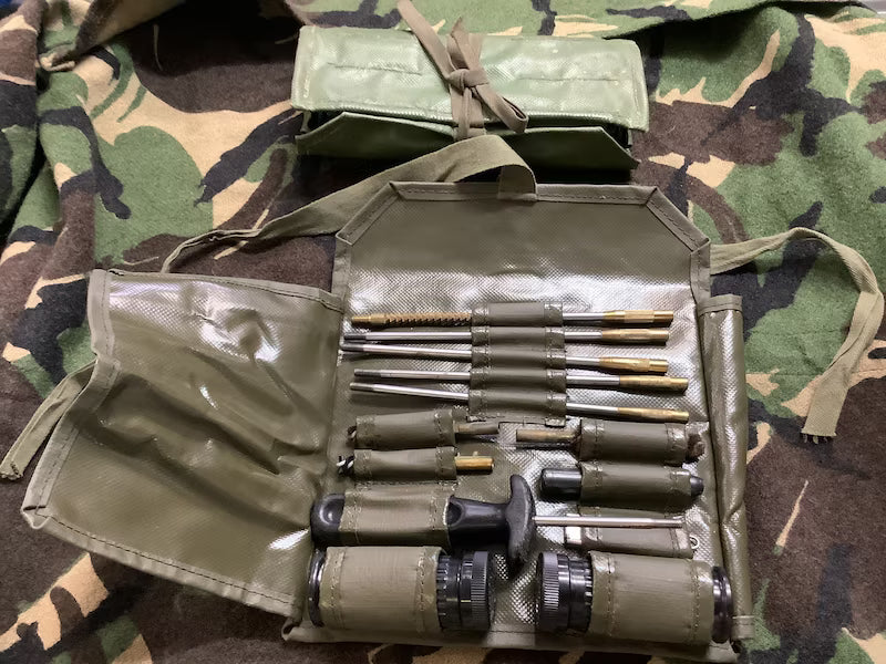 Set of tools in a green case on camouflage fabric