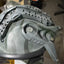Close-up of a gray helmet with visible branding on a blurred background