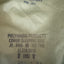 Text on a cover sleeping bag indicating brand and product details.