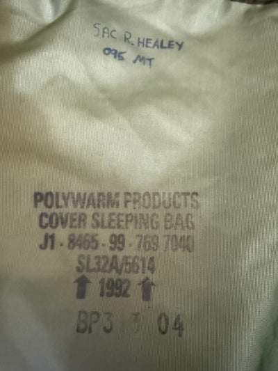Text on a cover sleeping bag indicating brand and product details.