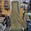 Green hunting blind in a store setting with various items in the background