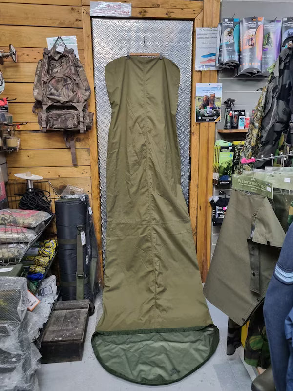 Green hunting blind in a store setting with various items in the background