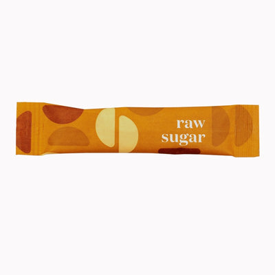 Bar of raw sugar with abstract designs on an orange background