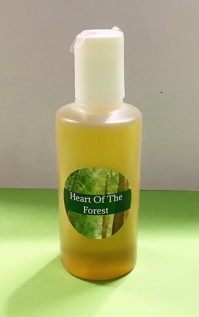 Bottle of 'Heart Of The Forest' product on a green surface with a neutral background