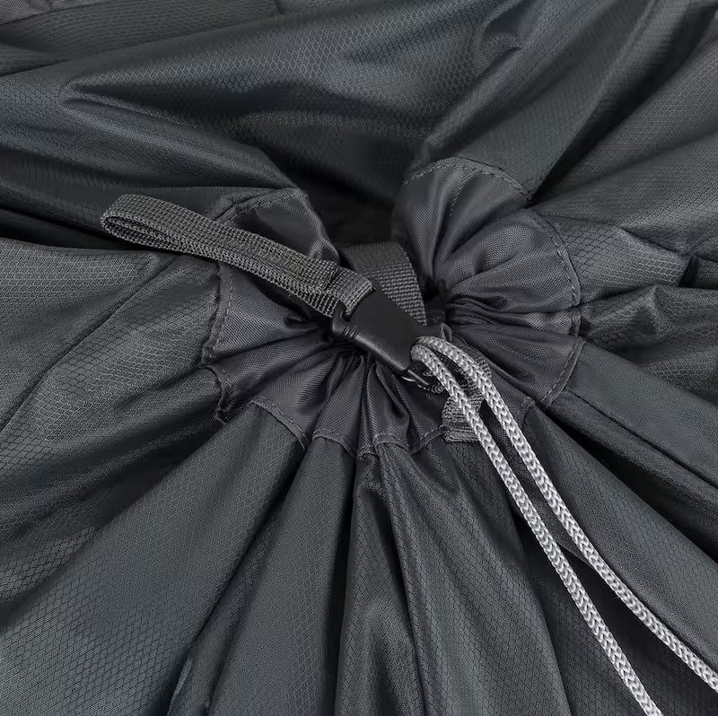 Close-up of a drawstring on a black bag with textured surface.