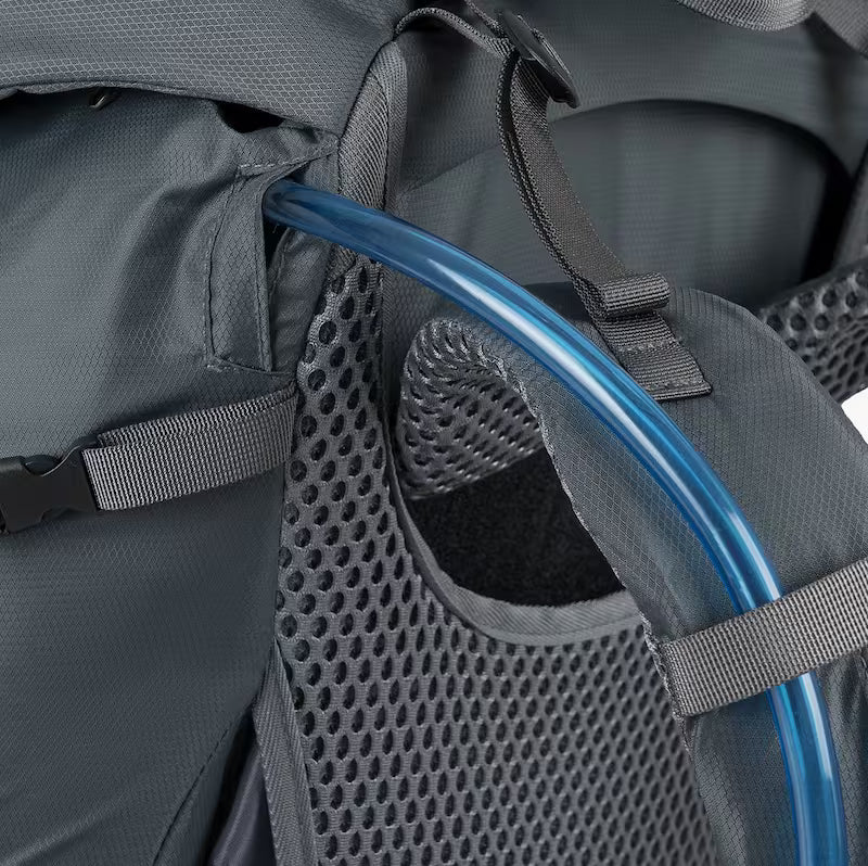 Close-up of a gray backpack with a blue water bottle inside a mesh pocket.