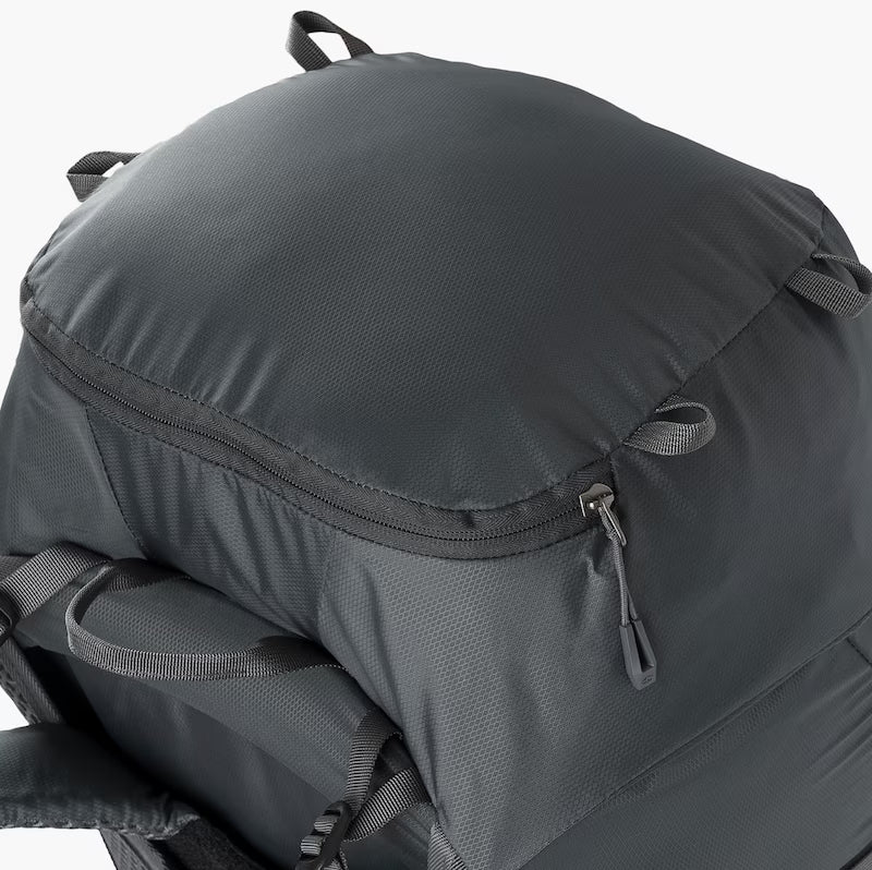 Close-up of a gray backpack with zippers on a white background
