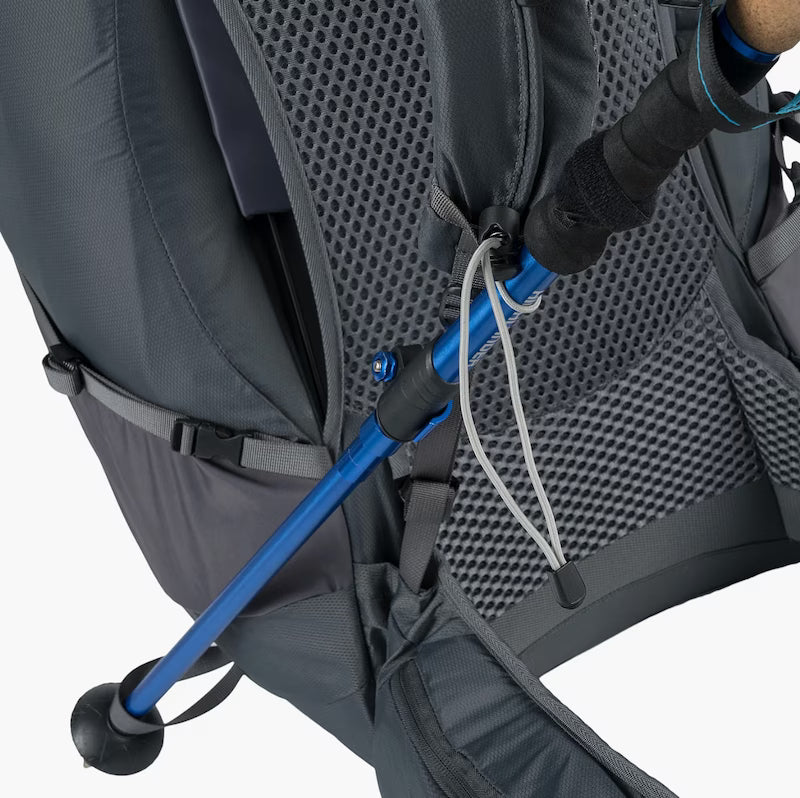 Close-up of a gray backpack with a blue handle and black straps on a white background