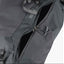 Close-up of a gray backpack with a visible brand logo on a white background