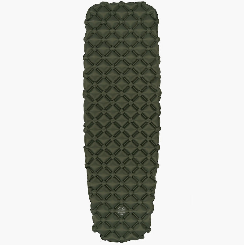 Green quilted sleeping pad on a white background