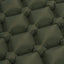 Dark green quilted pillows arranged in a pattern