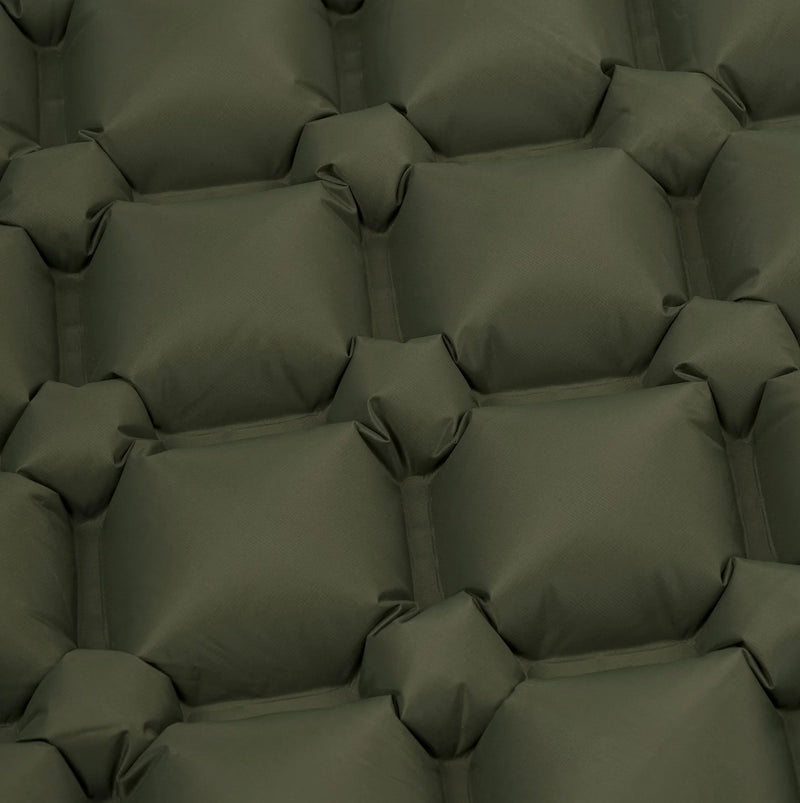 Pattern of green cushions with visible stitching