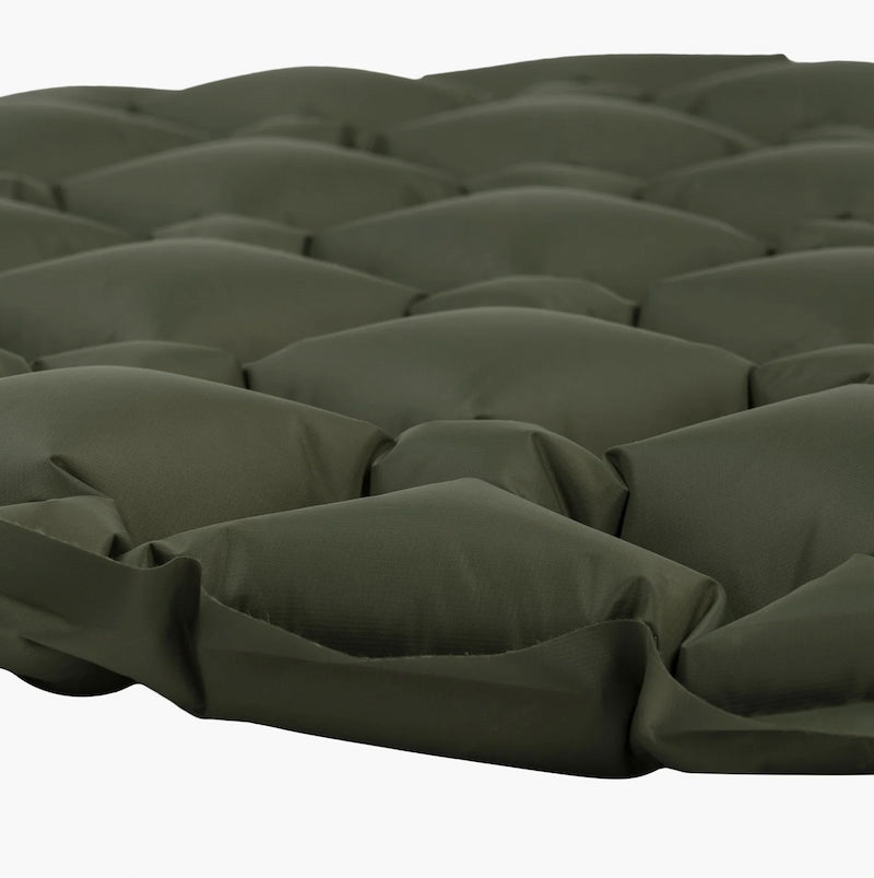 Dark green quilted mattress pad on a white background