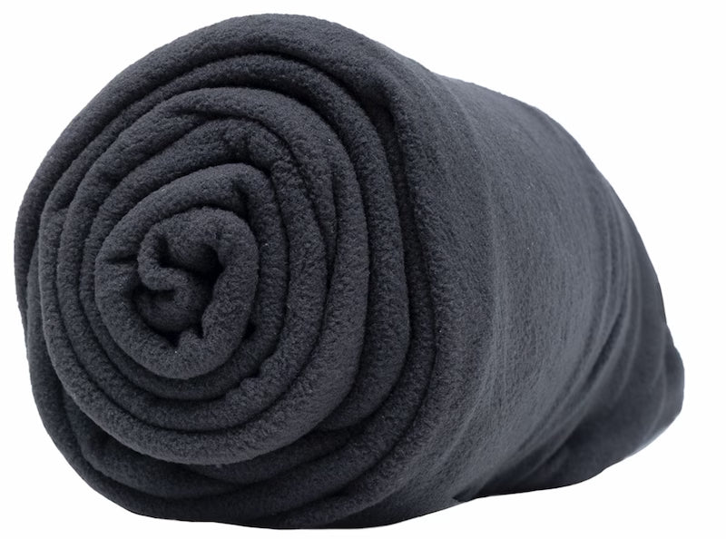 Rolled-up dark gray blanket on a white background