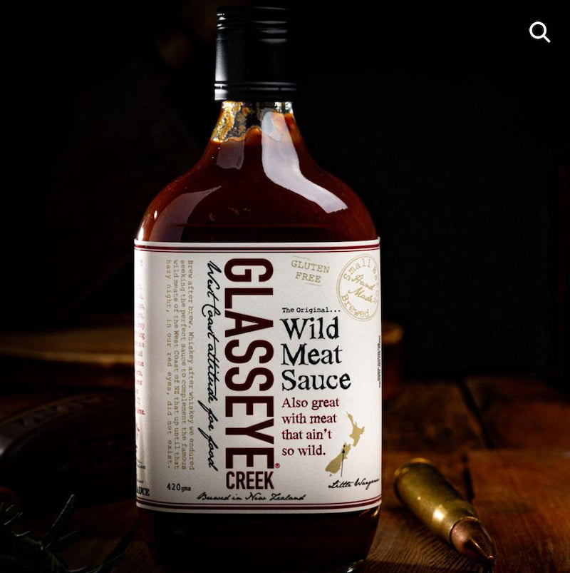 Bottle of Glasseye Creek Wild Meat Sauce on a dark background