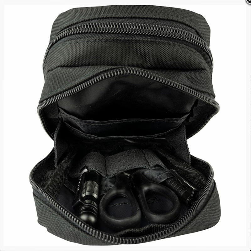 Black zippered pouch with grooming tools inside on a white background