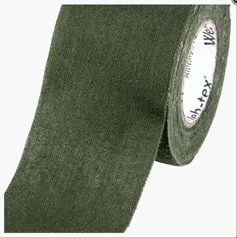 Roll of green tape with a brand label on a white background