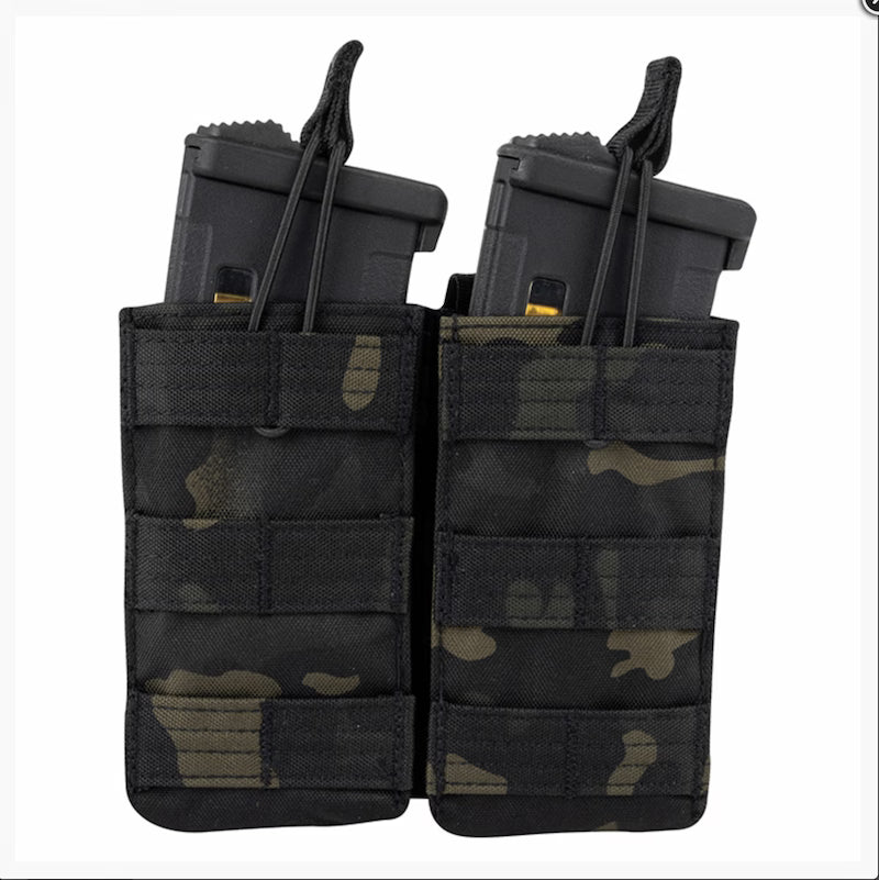 Black and green camouflage magazine pouch with two gun magazines on a white background