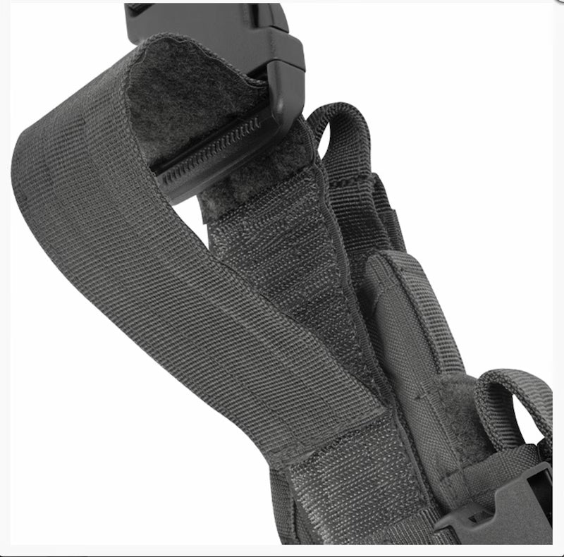 Close-up of a black tactical belt with straps on a white background