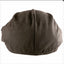 Brown flat cap on a white background