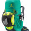 Green hiking backpack with helmet and water bottle on a white background