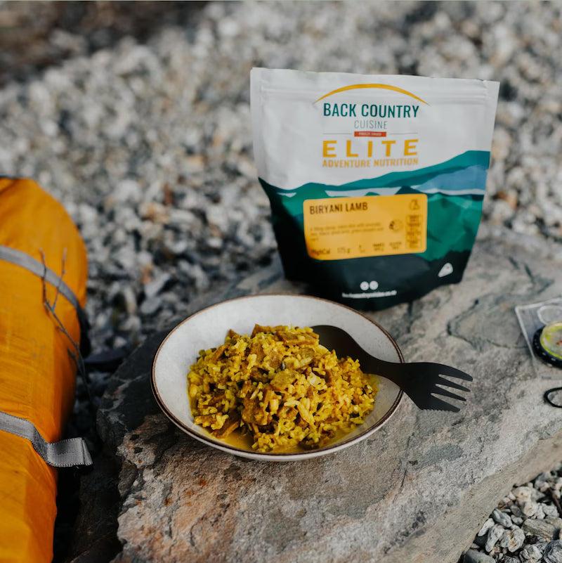 Backcountry Elite food package with a bowl of food on a rocky surface