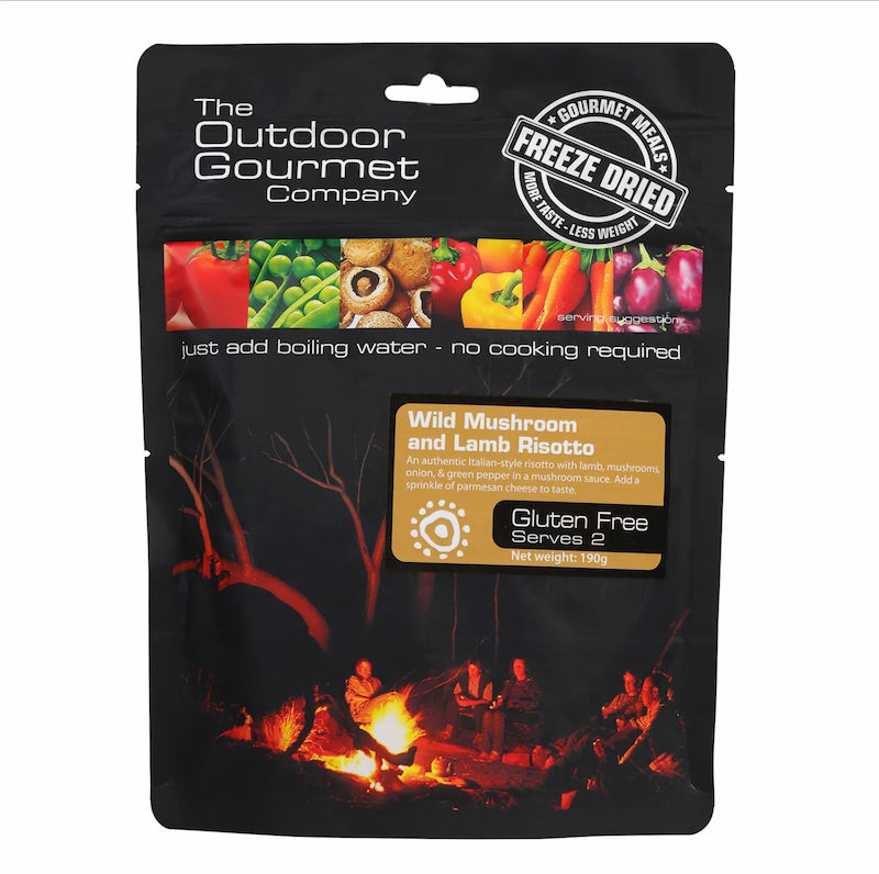Packaging of The Outdoor Gourmet Company freeze-dried meal with a campfire scene and food ingredients.