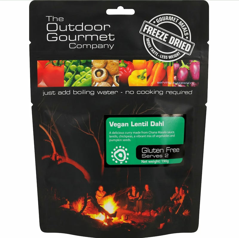 Packaged food from The Outdoor Gourmet Company with a campfire scene on the packaging.