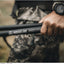 Hand holding a Ridgeline Speed Stick stick in a natural setting