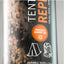 Can of tent repair spray with branding and product features.