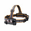 Fenix headlamp with black and orange strap on a white background