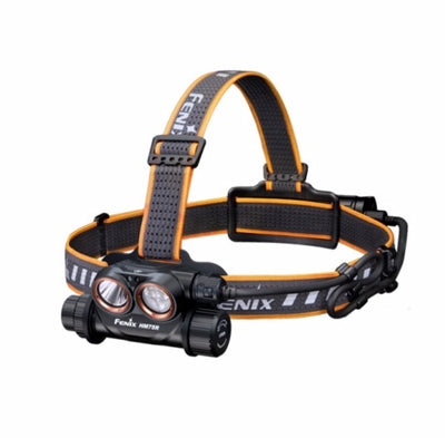 Fenix headlamp with black and orange strap on a white background