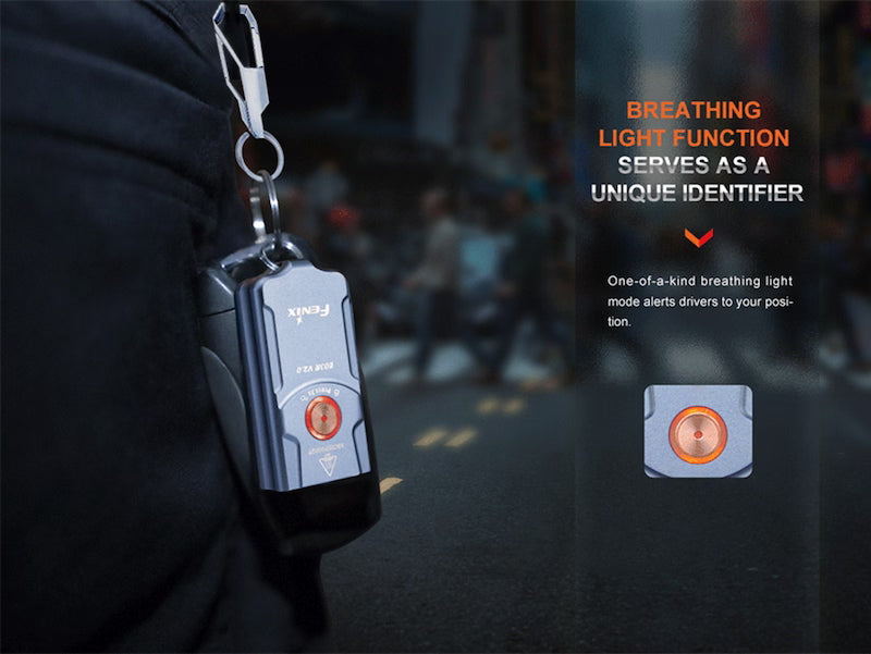 Keychain device with breathing light function on a blurred background