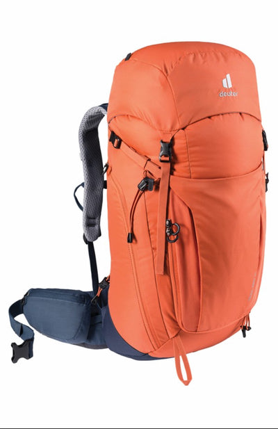 Orange hiking backpack with a visible brand logo on a white background