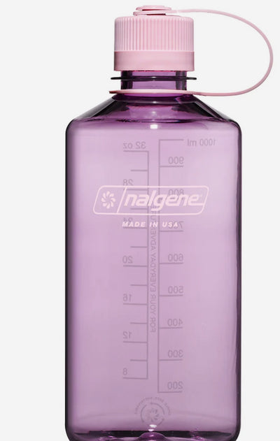 Purple Nalgene water bottle with pink cap on a white background