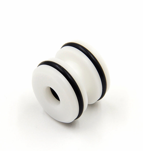 White mechanical component with black rubber seals on a white background