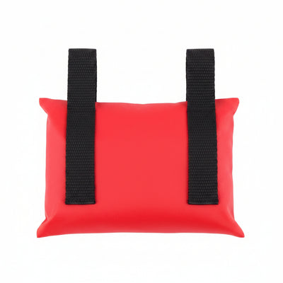 Red sandbag with black straps on a white background