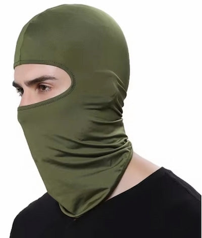 Person wearing an olive green balaclava on a white background