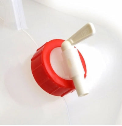 Red and white plastic valve on a white background