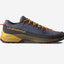 A La Sportiva trail running shoe in navy blue and black with mustard yellow laces, a yellow midsole, and red accents, shown against a light gray background.