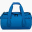 Blue duffel bag with straps on a white background
