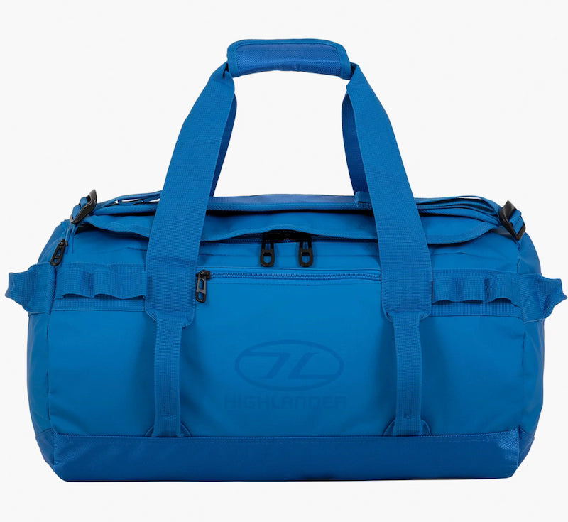 Blue duffel bag with straps on a white background