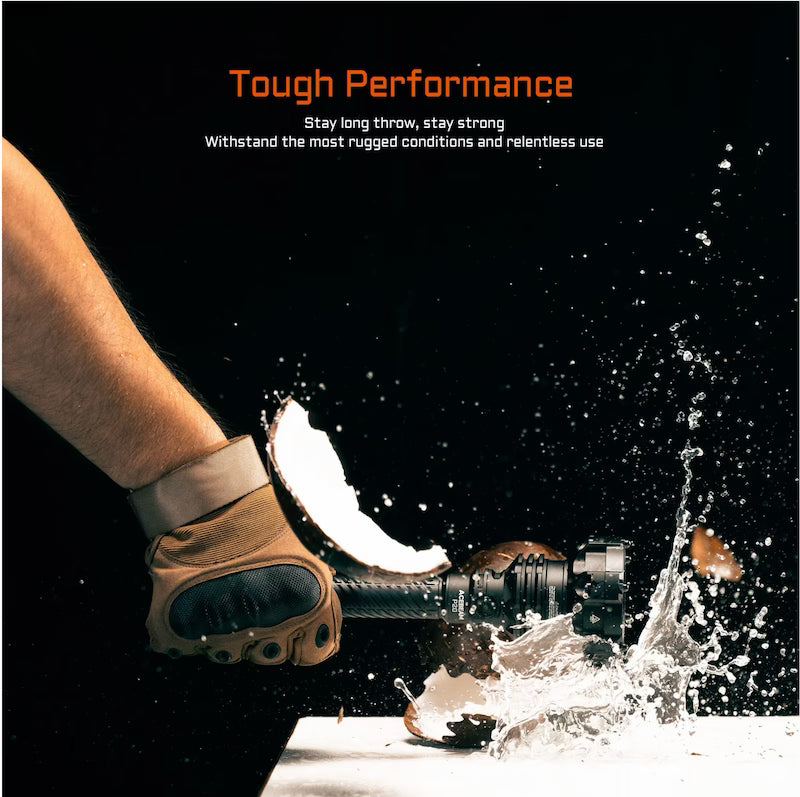 Glove holding a tool with water splashing, against a black background with 'Tough Performance' text.