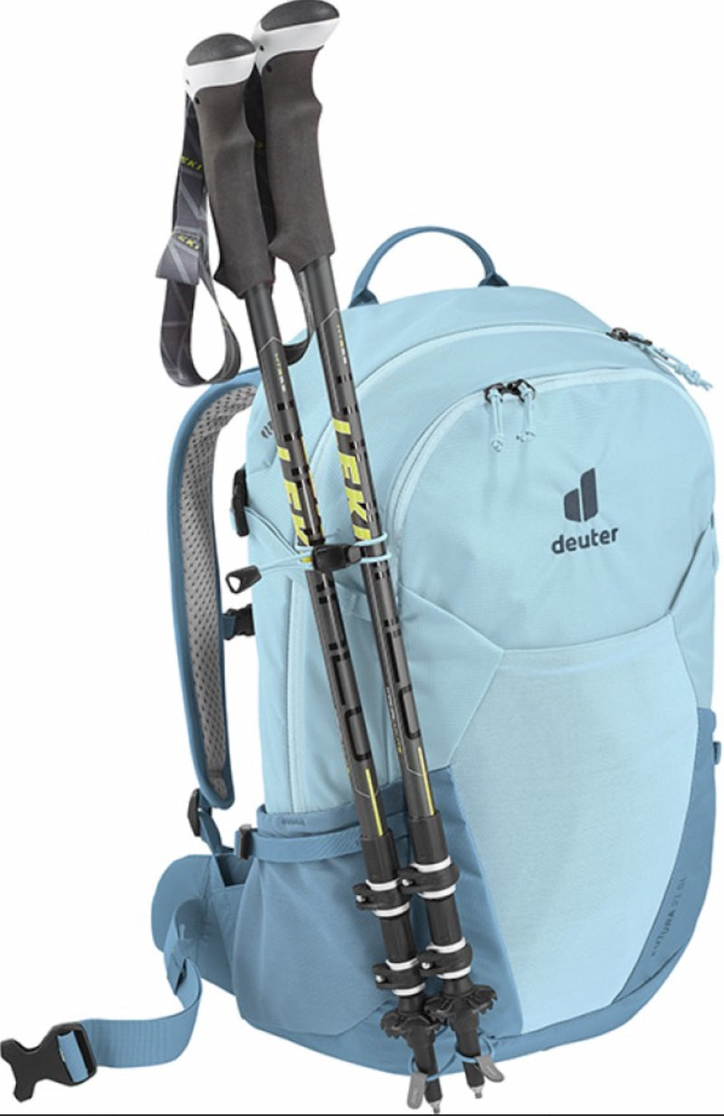 Light blue hiking backpack with trekking poles on a white background