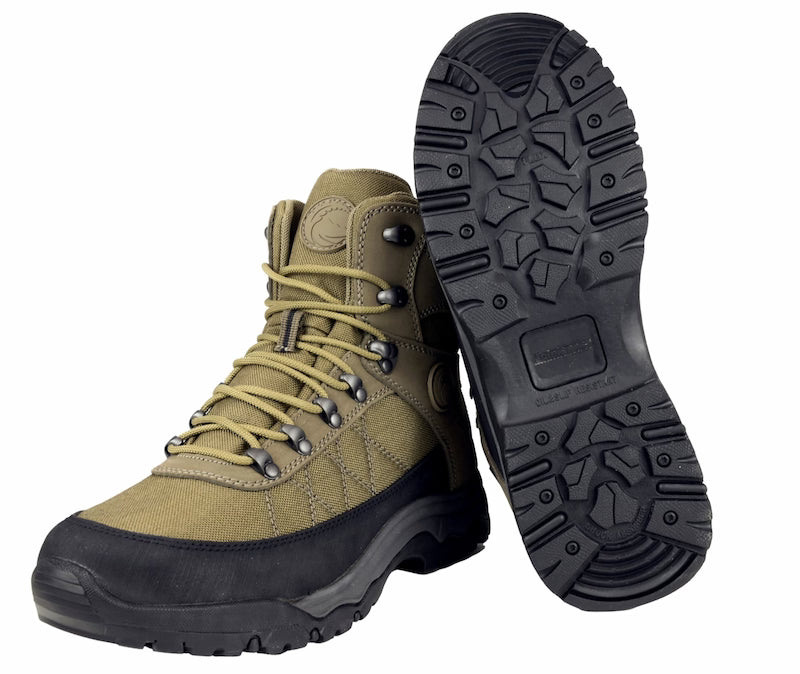 Khaki hiking boot with black sole on a white background